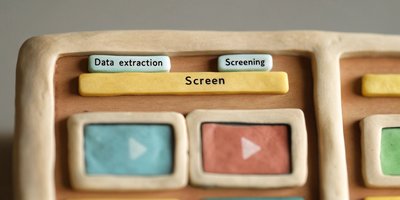 Clay interface buttons for 'Data extraction' and 'Screening,' representing stages in automated systematic reviews